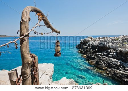 Old Dusty And Rusty Lantern Above Boat Dock Near Marmara Beach, Island Of Crete, Greece