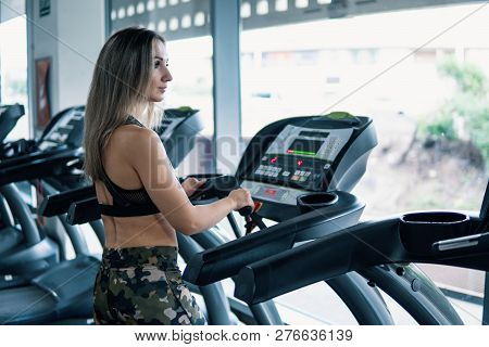 Young Fit Woman Doing Running Exercise In Gym