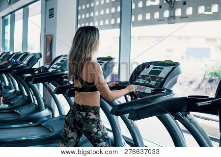 Young Fit Woman Doing Running Exercise In Gym