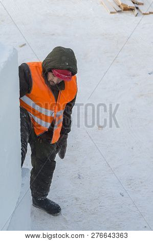 Slinger In An Orange Helmet At The Installation Site