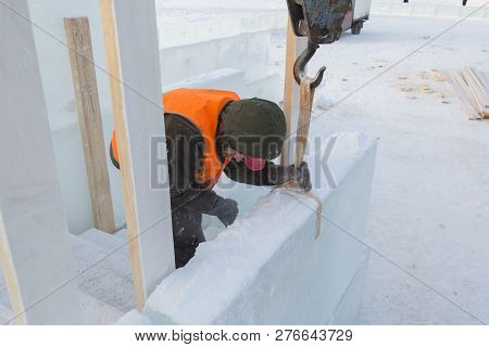 Slinger In An Orange Helmet At The Installation Site