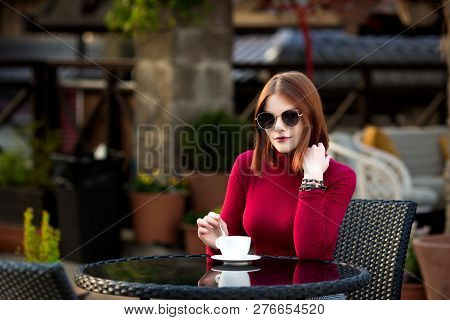 Lifestyle Fashion Portrait Of Young Stylish Hipster Woman Walking On The Street.
