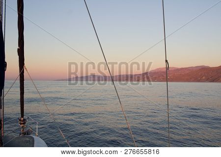 Mediterranean Sea Sunset View To Coast From Sailing Yacht