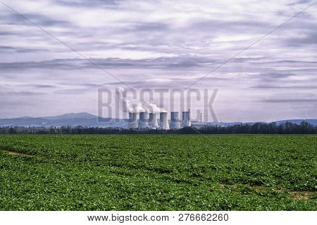 Power Plant Against The Dark Sky.power Station,coal Fired Power Station With Cooling Towers Releasin