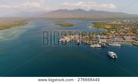 Aerial View Ferry Port Gilimanuk With Ferry Boats, Vehicles. Ferries Transport Vehicles And Passenge