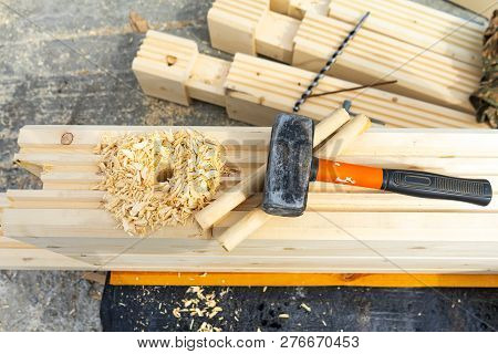 Construction Of The House From A Bar. Drilling Holes And Clogging Of Dowels.