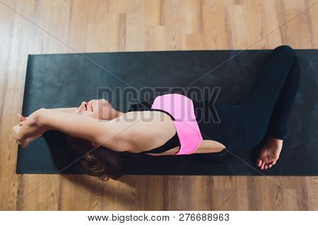 Young Woman Practicing Yoga, Stretching In Variation Of Reverse Table Top Exercise, Bridge Pose, Wor