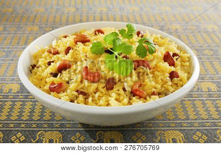 Indian Rice Pilau In White Bowl - Classic Fruit And Nut Indian Pilau, Basmati Rice Cooked With Stock