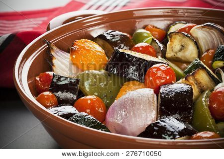 Ratatouille - An Earthenware Dish Filled With Oven Baked Medieterranean Vegetables, Or Ratatouille.