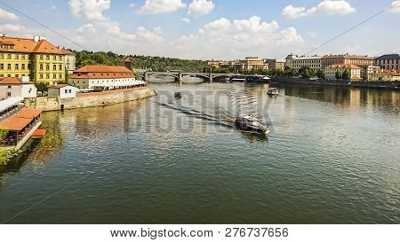 View Banks Of The Vltava River , Tourist Boats And The Manesuv Bridge In The Historical Center Of Pr