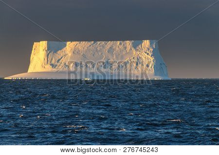 Antarctic Sunset: Floating Icebergs In The Weddell Sea, Near The Antarctic Peninsula, As Seen From A