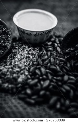 Close Up Of Paste Of Custard Apple Seeds In A Glass Bowl With Some Powdered Seeds And Raw Dried Seed