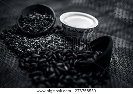 Close Up Of Paste Of Custard Apple Seeds In A Glass Bowl With Some Powdered Seeds And Raw Dried Seed