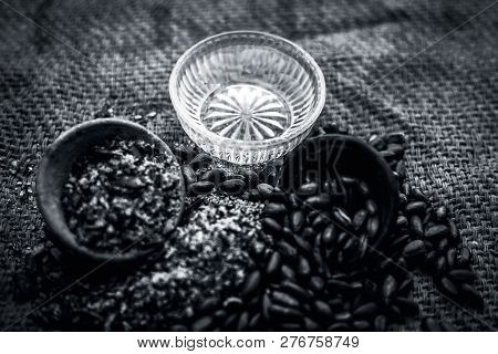 Home Remedy To Cure Lice Or Joon On Brown Colored Surface I.e. Custard Apple Seeds Dried And Powdere