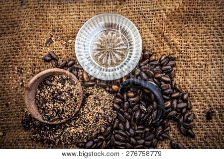 Home Remedy To Cure Lice Or Joon On Brown Colored Surface I.e. Custard Apple Seeds Dried And Powdere