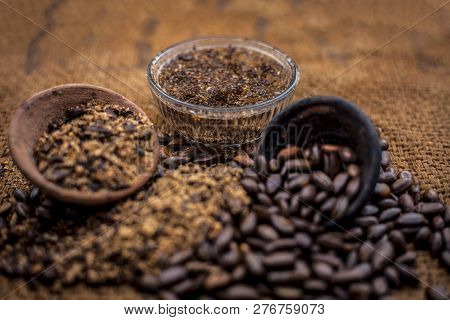 Home Remedy To Cure Lice Or Joon On Brown Colored Surface I.e. Custard Apple Seeds Dried And Powdere
