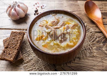 Kharcho Soup With Meat And Rice On Wooden Table