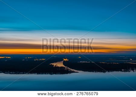 Beautiful River With Big Island With Trees Under Predawn Sky. Bright Orange Stripe In Picturesque Cl