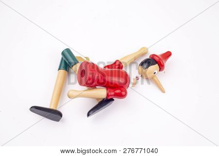Toy Puppet Broken Pinocchio On White Background