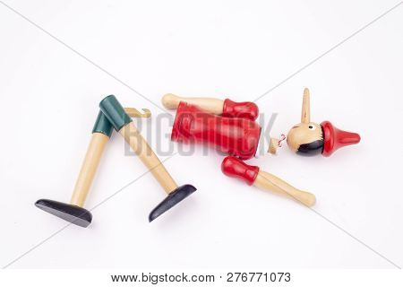 Toy Puppet Broken Pinocchio On White Background
