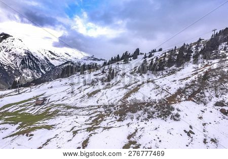 Snowy Landscape In Swiss Alps On A Spring Day