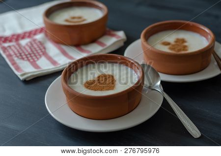 Traditional And Delicious Rice Pudding With Cinnamon In Bowl. Tasty And Nutritious Food.