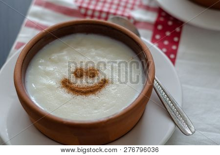 Traditional And Delicious Rice Pudding With Cinnamon In Bowl. Tasty And Nutritious Food.