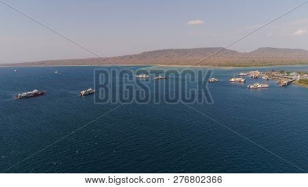 Aerial View Ferry Port Gilimanuk With Ferry Boats, Vehicles. Ferries Transport Vehicles And Passenge