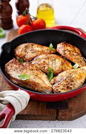 Cooked Chicken Breast Seared In A Cast Iron Skillet