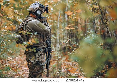 Kyiv, Ukraine - October 14, 2017: Man In Military Uniform With Rifle Talking On Mobile Phone During 