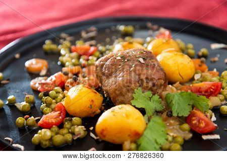 Beef meat stewed with potatoes-Traditional French cuisine Beef Bourguignon potatoes carrots in persillade
