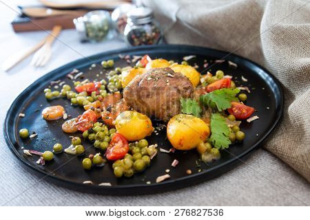 Beef meat stewed with potatoes-Traditional French cuisine Beef Bourguignon potatoes carrots in persillade