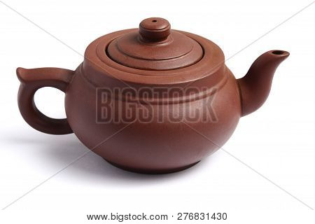 Round Teapot Of Brown Clay With A Lid On A White Background Without Drawings And Inscriptions