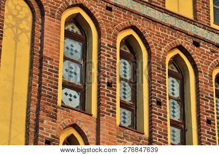Fragment Of The Facade Of The Koenigsberg Cathedral  On The Kneiphof Island. Windows With Stained Gl