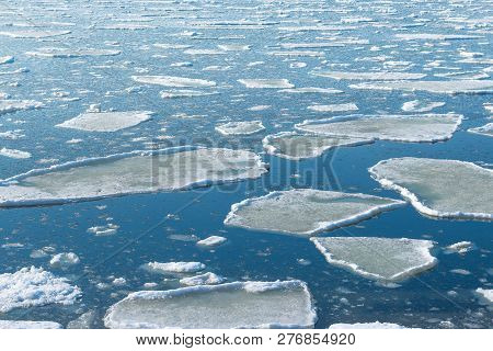 Drift Melting Ice On Seashore Of Japan Sea. Seasonal Change, Environmental Protection And Global War