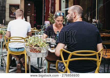 Prague, Czech Republic - August 23, 2018: People Drinking Beer At The Outdoor Tables Of A Restaurant
