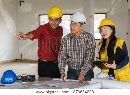 Team Of Business People In Group, Architect And Engeneer On Construciton Site Check Documents And Bu