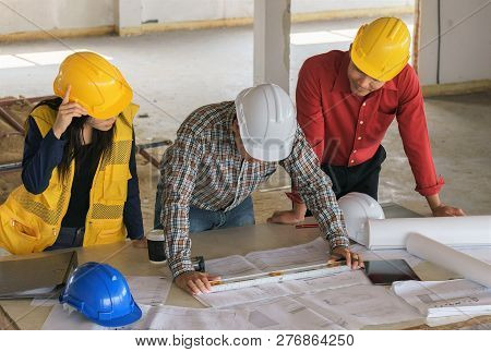 Team Of Business People In Group, Architect And Engeneer On Construciton Site Check Documents And Bu