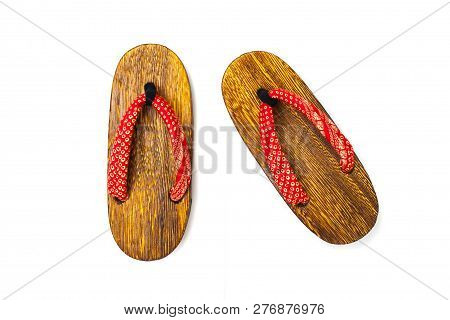 Close Up Old Used Wooden Japanese Sandal Isolated On White Background. It Is A Form Of Traditional J
