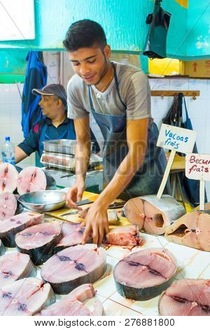 Curepipe / Mauritius Island - 28. October, 2018: Unidentified native fisherman selling his fish catch on traditional city market.