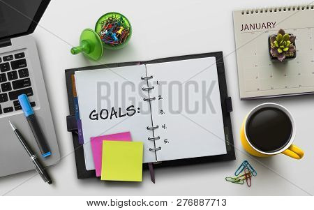 New Year Goals, Resolution Or Action Plan Concept. Notebook On Table With Laptop, Calendar, Coffee, 