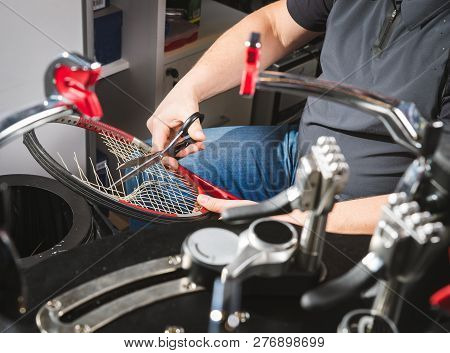 Melbourne, Australia, 2009, January 17: Racquet Stringer Weaving Cross Strings Of Synthetic Gut Stri