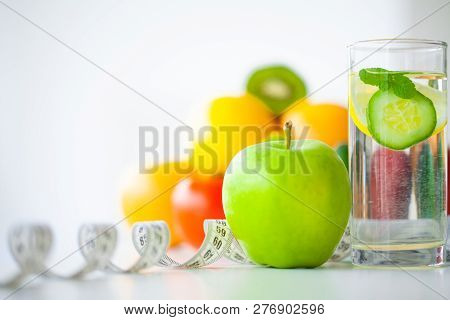 Diet. Fitness And Healthy Food Diet Concept. Balanced Diet With Fruit. Fresh Fruit, Measuring Tape O