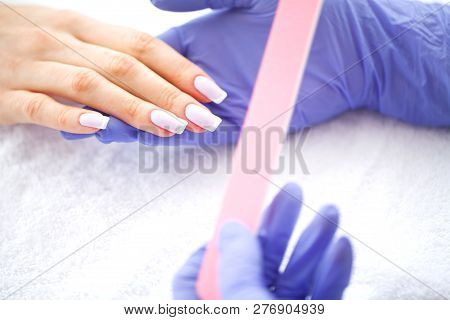 Spa Manicure. French Manicure At Spa Salon. Woman Hands In A Nail Salon Receiving A Manicure Procedu