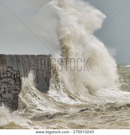 Stunning Waves Crashing Over Harbor Wall During Windy Storm At Newhaven On English Coast