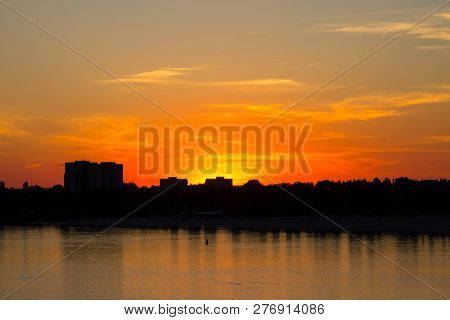 Orange Sunset Over A River Dnieper In Kremenchug City, Ukraine