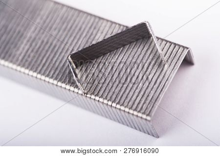 Office Stapler With Staples On A White Background.