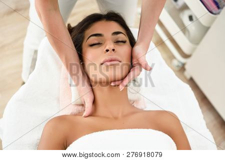 Woman Receiving Head Massage In Spa Wellness Center.