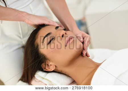 Woman Receiving Head Massage In Spa Wellness Center.