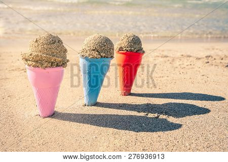 Colorful Sand Cones In The Sand On The Beach,summer Concept,used Split Toning For Vintage Style.